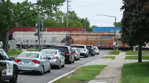 USA, Aurora, Il. 25 May 2026. Freight trains with shipping containers moving Stock Footage 335966512