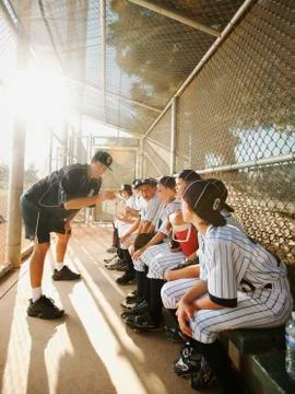 USA, California, Ladera Ranch, Boys (10-11) from little league sitting on dugout Stock Photos