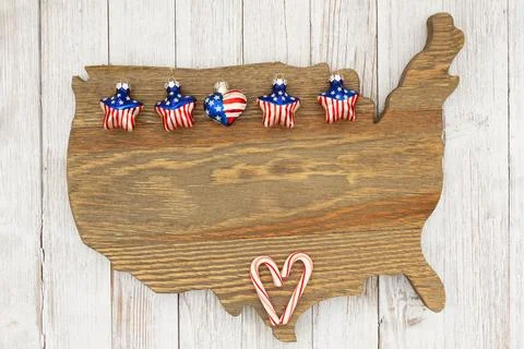 USA Christmas ornaments stars on weathered wood USA map US background Stock Photos