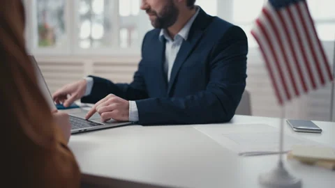 USA consular service employee checking computer data, issuing visa to applicant Stock Footage 240835962
