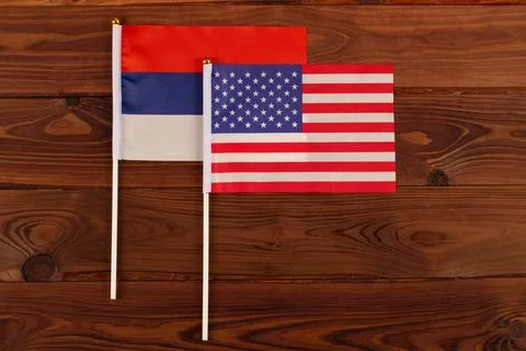 USA flag on the background of the flag of Russia. USA vs Russia Stock Photos