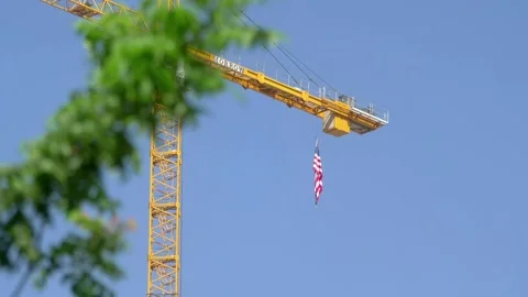 USA Flag on a Construction Crane in 4k slow motion 60fps Stock Footage 288343049