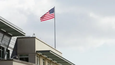 USA Flag on a Flagpole Flying in the Wind Stock Footage 279396302