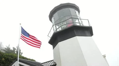 USA Flag Flying next to Cape Meares Lighthouse in Netarts Oregon 1080p Stock Footage 12108629