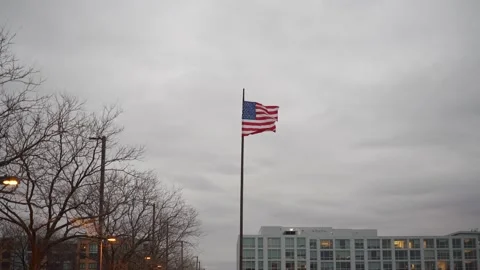 USA Flag flying on post during overcast day. Stars and Stripes Flag. Freedom Stock Footage 147978812