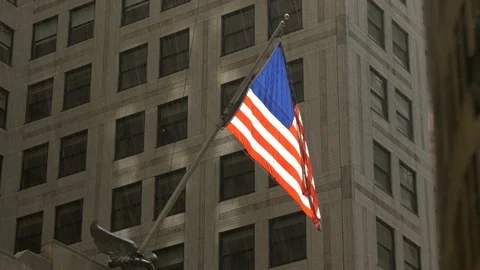 USA flag flying in the rain on the front of the CHrysler Building Stock Footage 88200212
