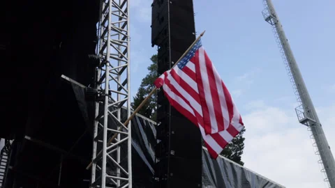 USA Flag flying on the stage construction. American flag flying outside. Stock Footage 205065633