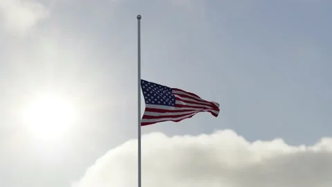 USA flag half mast in the wind. High bitrate slow motion animation in 4K. Stock Footage 219301074