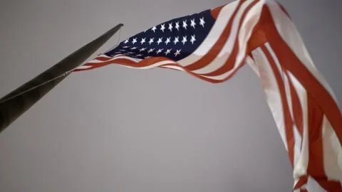 USA flag on pole seen from below. Flag flying in the wind Video stock 200001314