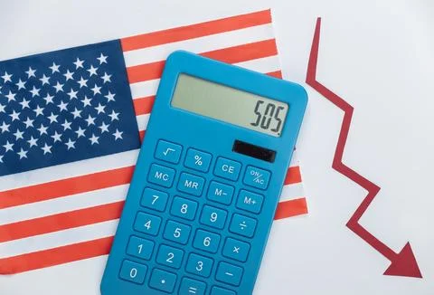 USA flag with red Fall arrow and calculator. Fall graph going down. Economic  Stock Photos