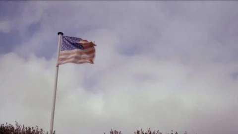 USA flag waving in the wind | 4K - VINTAGE STYLE - 8MM FILM MAGENTA Stock Footage 98662195