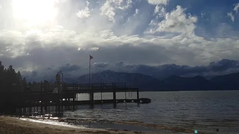 USA flag waving in the wind, at a harbor, on a cloudy and sunny november da.. Stock Footage 72425314