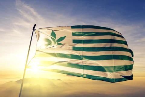 USA flag weed mariguana marijuana flag waving on the top sunrise mist fog Stock Photos