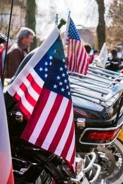 USA Flags are displayed at the back of motorbike on Czech Motor season opening. Stock Photos