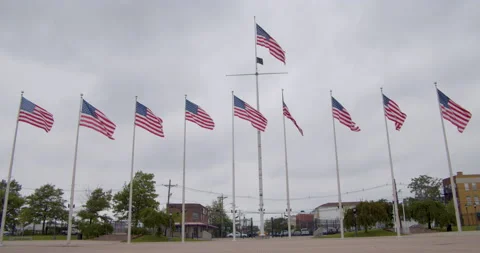 USA flags blowing in wind in slow motion Stock Footage 135427140