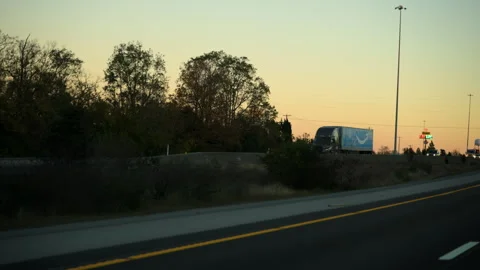 USA, Halls TN, 14 Novem 2025. Amazon delivery truck drives along a highway Stock Footage 327770997
