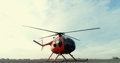 The USA Helicopter Of The Old Sample Of Red Color Made Landing On Airfield Stock Footage 122019117