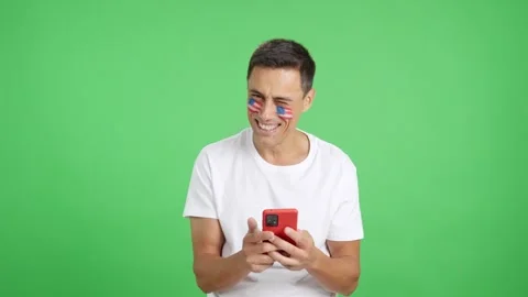 USA man looking at his mobile smiling and showing it. Видео 252058331