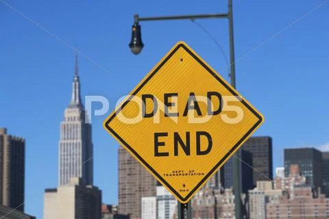 USA, New York City, Cityscape with Dead End road sign Stock Photos
