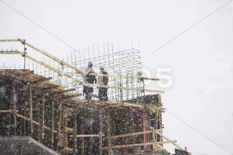 USA, New York City, construction site in snowstorm Stock Photos