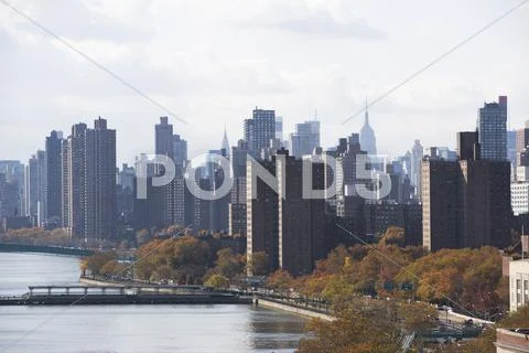 USA, New York City, View of lake in Central Park and Manhattan skyline Stock Photos