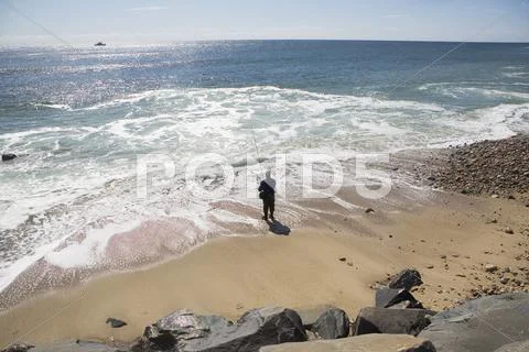 USA, New York, Long Island, Montaurk, Man fishing in sea Stock Photos