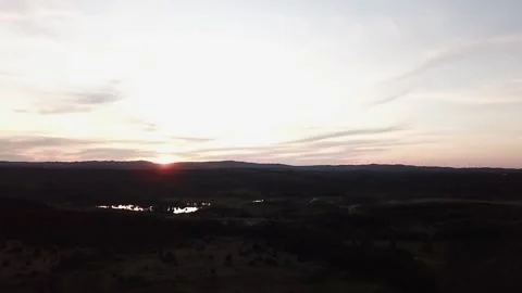 USA-sunset-flyover-wind-turbines-in-distance Stock Footage 133586089