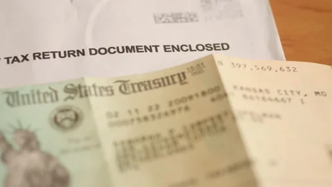 USA tax return envelope and Treasury cheque. Slider shot. Stock Footage 176408227