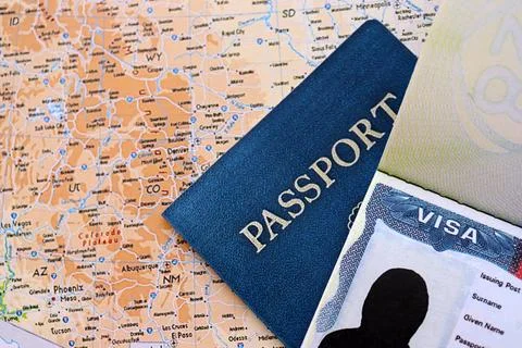 USA visa background. US visa in passport on United States geographical map Stock Photos