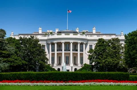 USA, Washington D.C., White house with green grass and summer sky Stock Photos