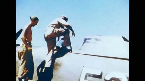 USAAF - Pilot of P-47 Thunderbolt enter cockpit Stock Footage 108493505