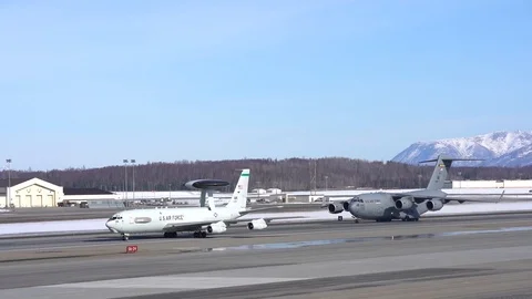 USAF E-3 Sentry and C-17 Globemaster taxiing at Joint Base Elmendorf-Richardson Stock Footage 105289710