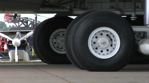 USAF Lockheed C-5 Galaxy - taxi past camera,- close-up on tires Stock-Footage 90400299