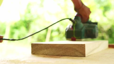 Usage of bosch orbital sander on newly built furniture piece Stock Footage 246790600