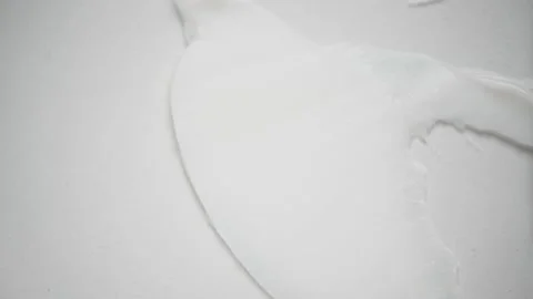 Usage of tool to smear jet of squeezed moisturizing cream Stock Footage 170551476