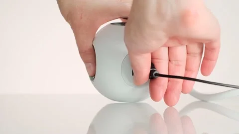 USB adapter.charging station.Hands and USB cable in the charger. Stock Footage 161800725