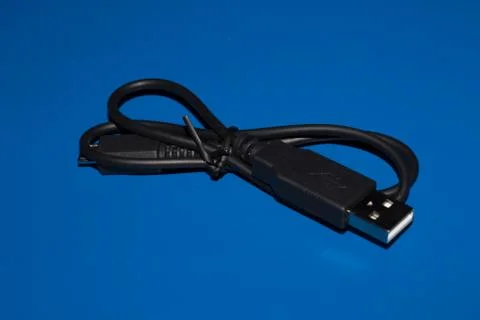USB and micro USB cable blue background. Stock Photos