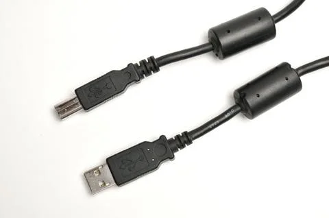USB A and USB B printer plug cable on white background Stock Photos