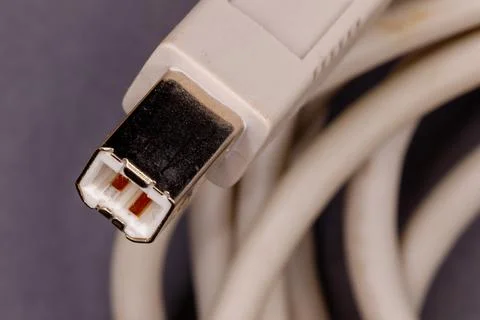 Usb b cable connector on coiled white cord Stock Photos