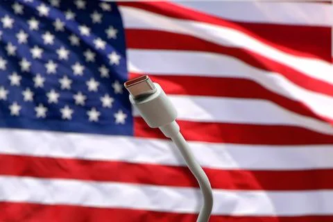 USB-C cable with the American Flag on the background Stock Photos