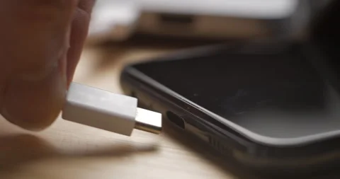 USB-C cable macro plugin to smartphone slow motion Video stock 281040462