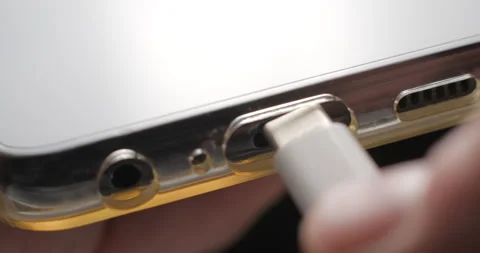 USB-C cable macro plugin to smartphone slow motion Video stock 281040506