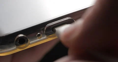USB-C cable macro plugin to smartphone slow motion Video stock 281040556