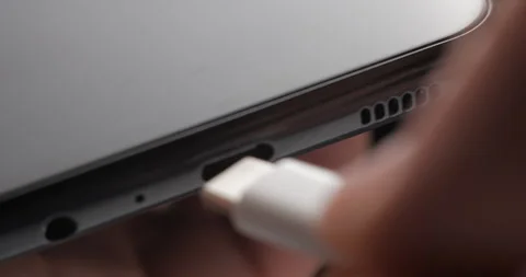 USB-C cable macro plugin to smartphone slow motion Video stock 281040618