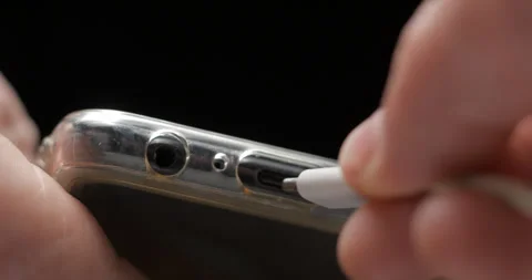 USB-C cable macro plugin to smartphone slow motion Video stock 281040635