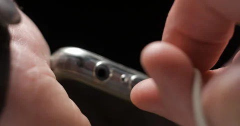 USB-C cable macro plugin to smartphone slow motion Video stock 281040677