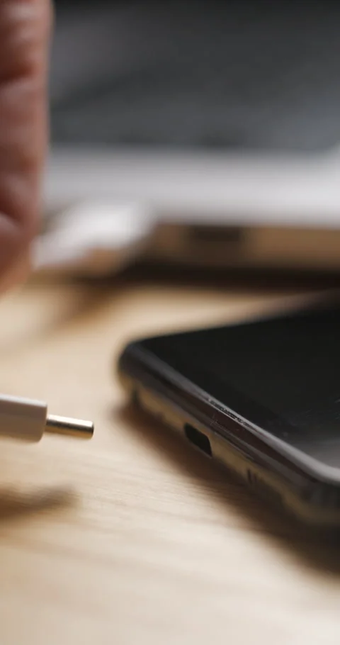 USB-C cable macro plugin to smartphone slow motion, vertical view Video stock 281040767