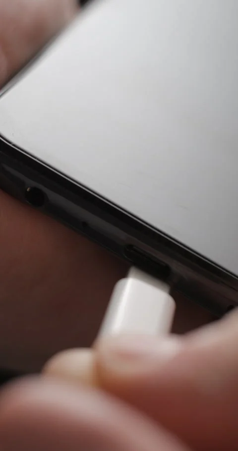 USB-C cable macro plugin to smartphone slow motion, vertical view Video stock 281040786