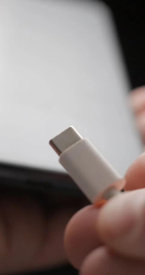 USB-C cable macro plugin to smartphone slow motion, vertical view Video stock 281040830