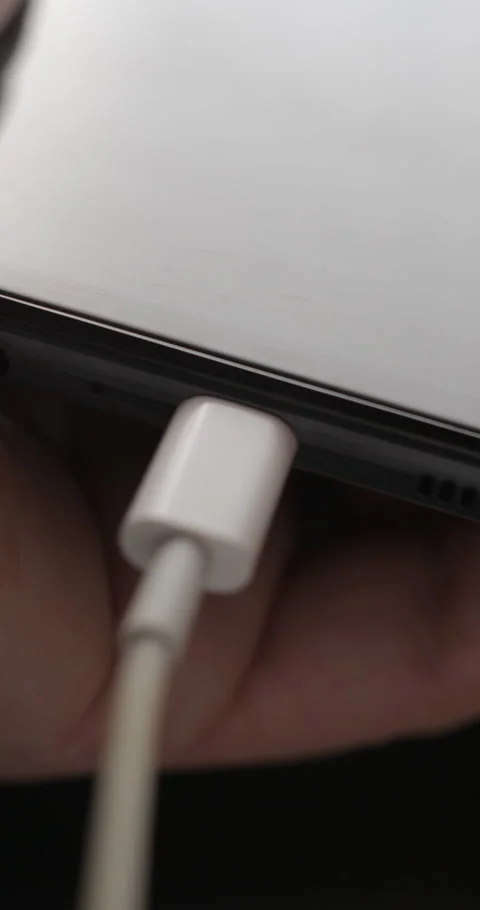 USB-C cable macro plugin to smartphone slow motion, vertical view Video stock 281040873
